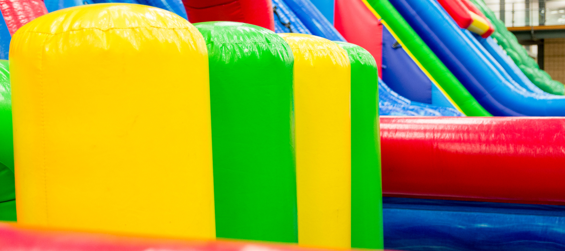Rainbow colored inflatable slides blown up
