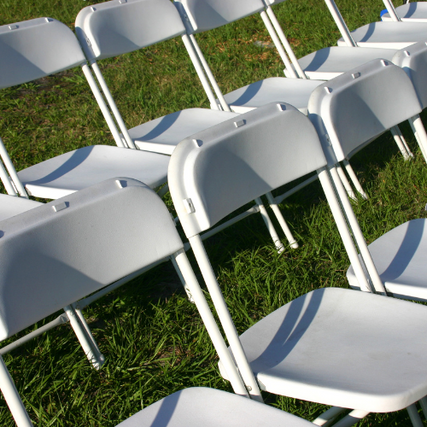 Sporting EventsA line up white foldout chairs.